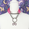 Pink and Polished metal Pull-Chain choker necklace with matching puppy dog bone pendant displayed on mannequin