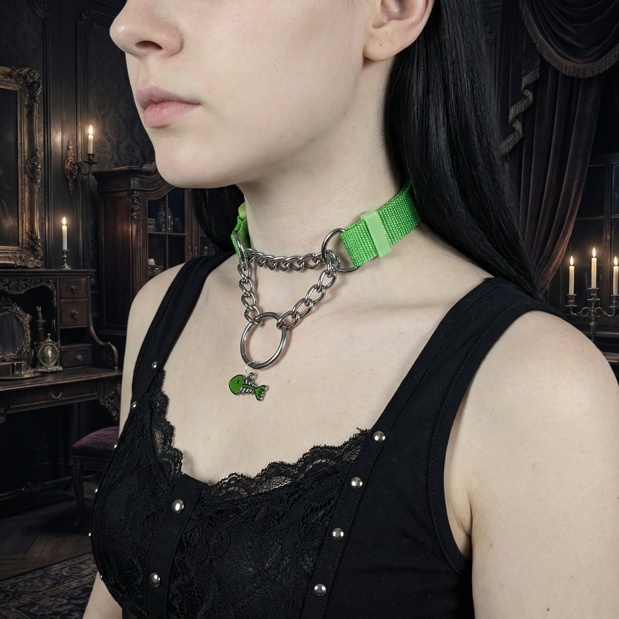 Person wearing a green choker necklace with a chain and small green charm in a dark, ornate room.