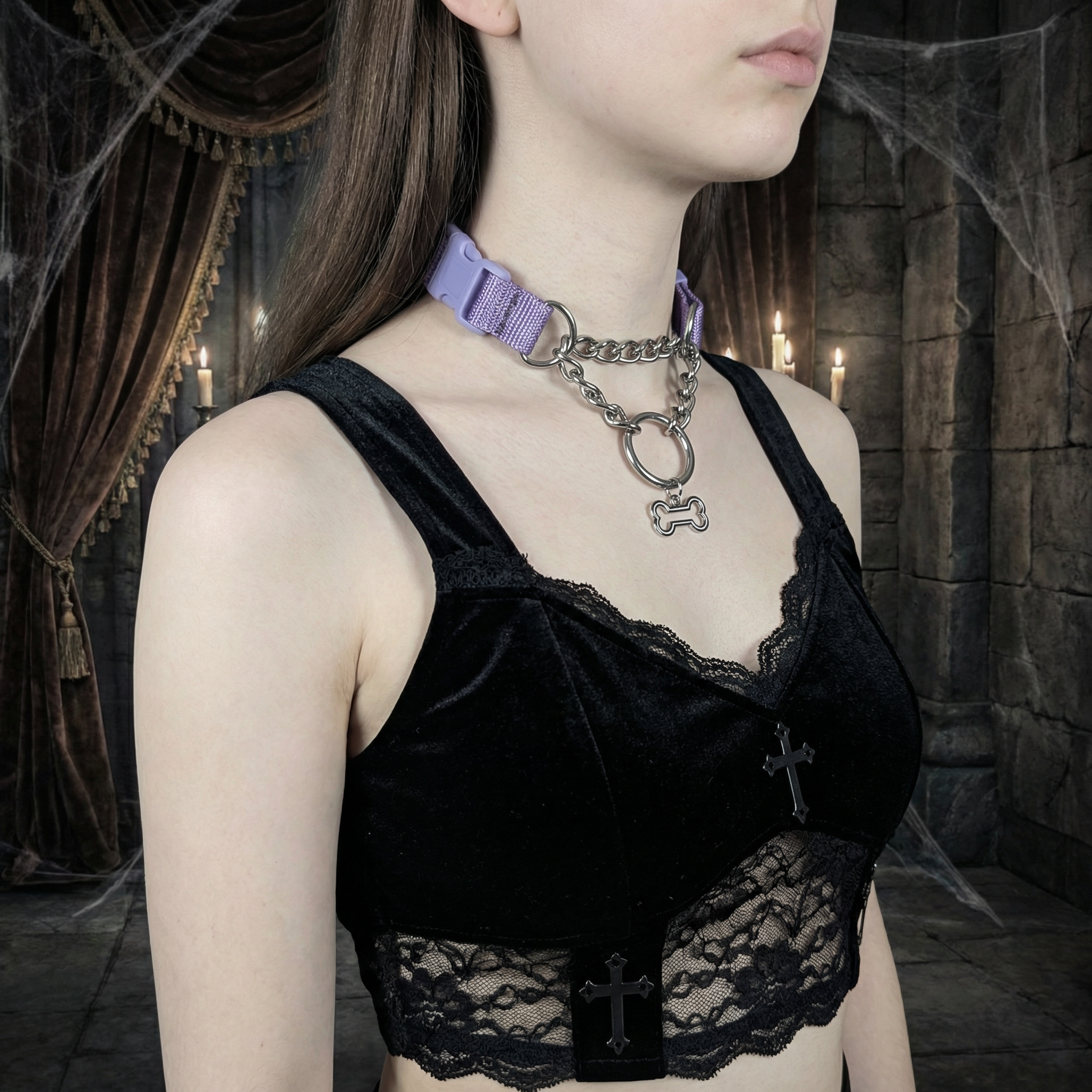 Person wearing a black lace top with a purple collar and chain in a dark, possibly gothic setting.